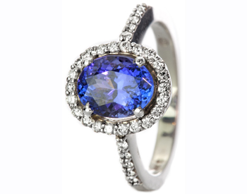 14K WHITE GOLD OVAL TANZANITE AND DIAMOND HALO RING | Genovese Jewelers