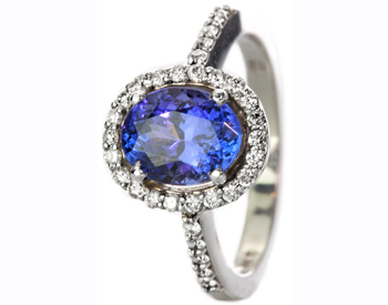 14K WHITE GOLD OVAL TANZANITE AND DIAMOND HALO RING