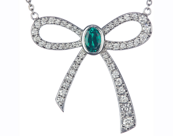 14K WHITE GOLD PAVE DIAMOND BOW AND OVAL EMERALD CENTER PENDANT